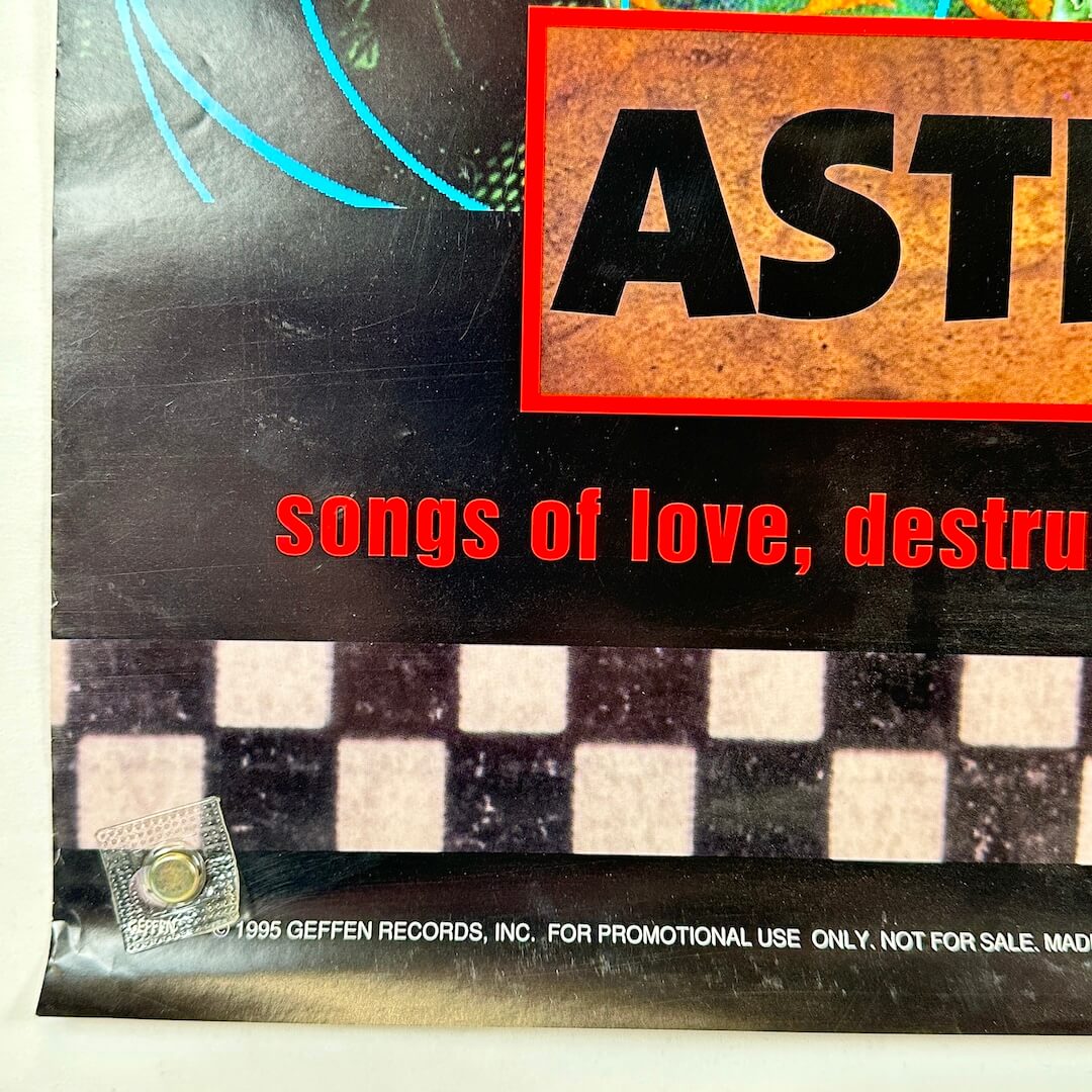 Bottom left corner with some edge wear and copyright information. 