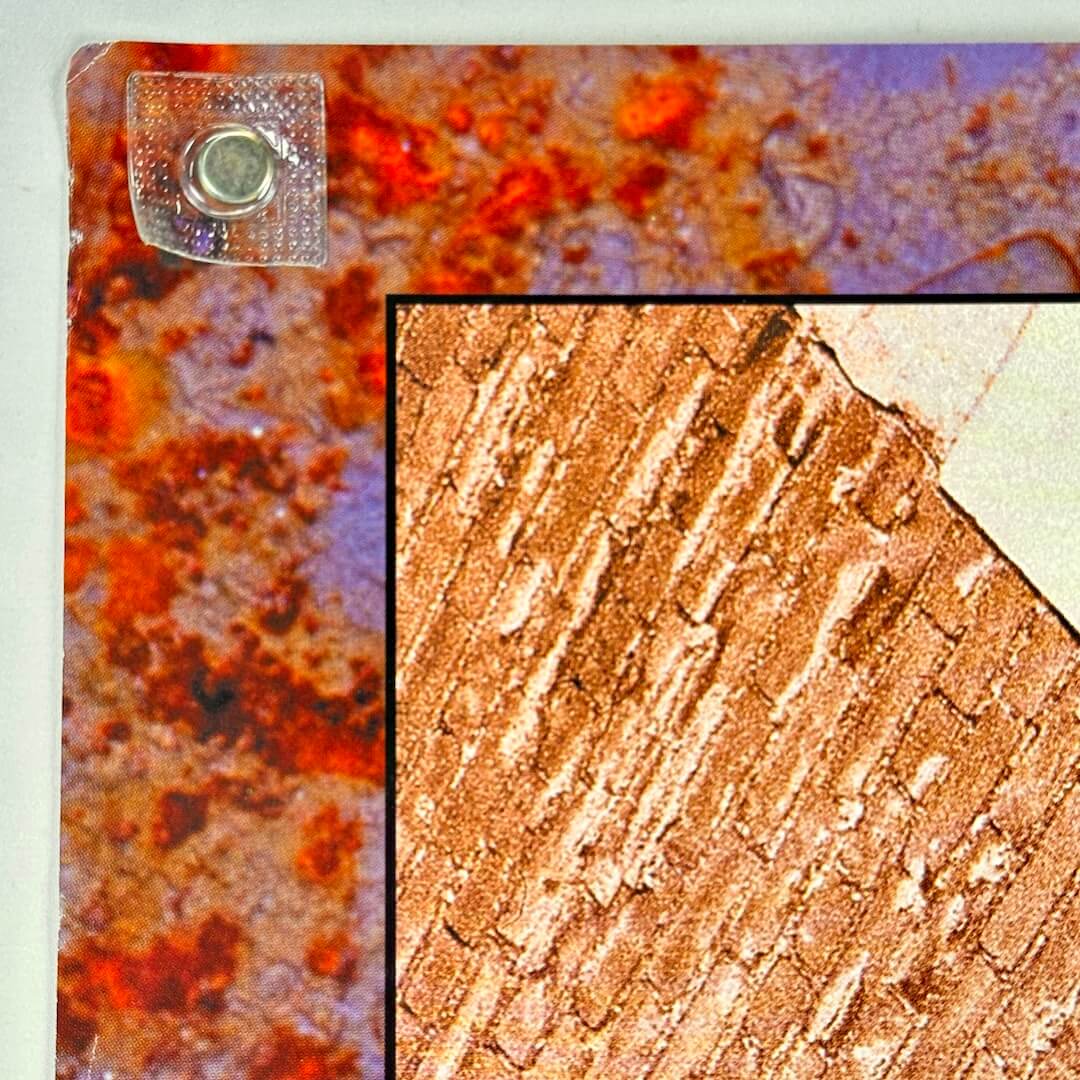 Top left corner with crease across corner. 