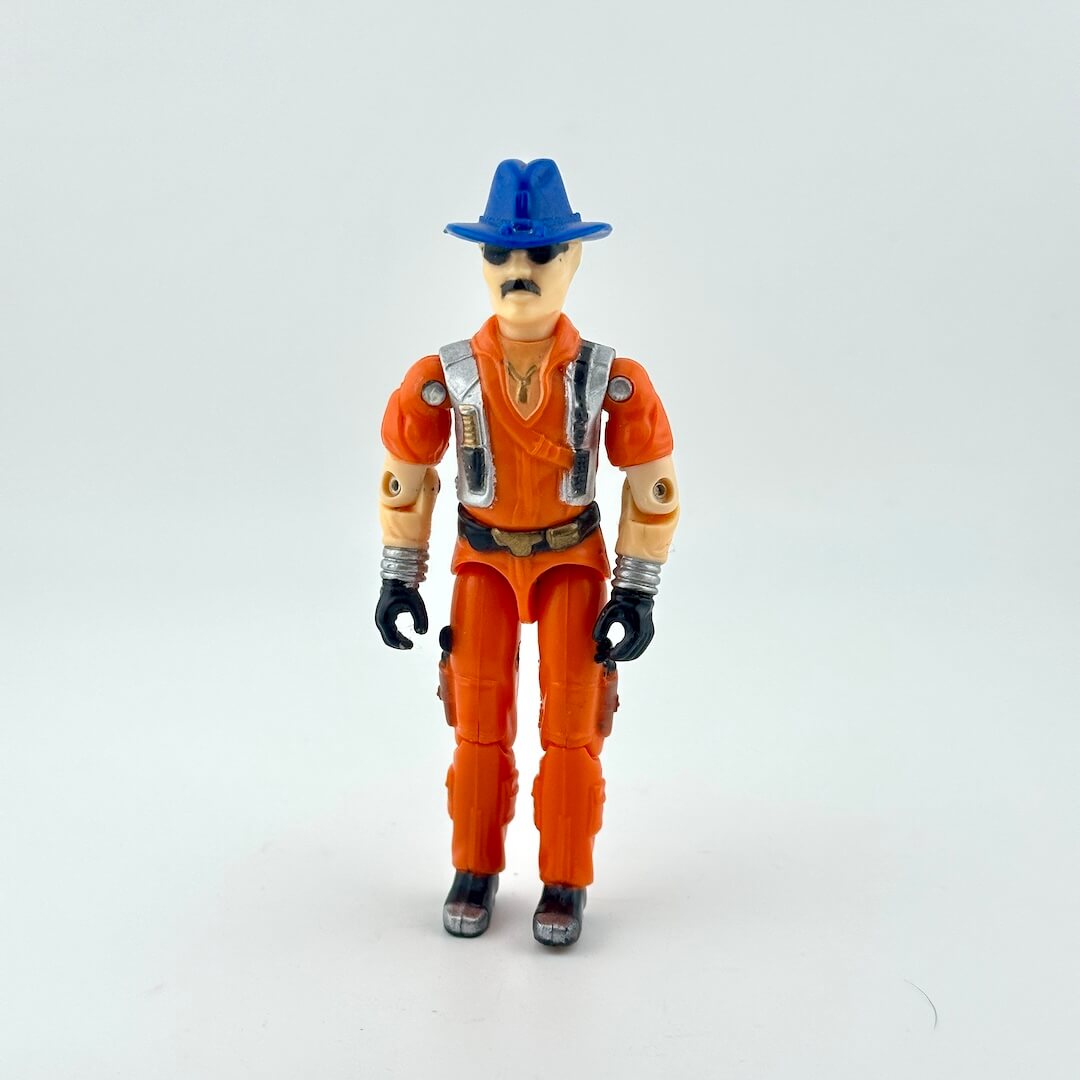 Action figure in orange jumpsuit and blue hat on a white background