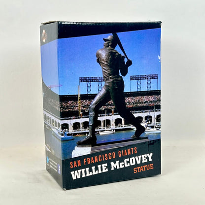 A boxed Willie McCovey San Francisco Giants statue collectible, featuring a printed image of the bronze statue.