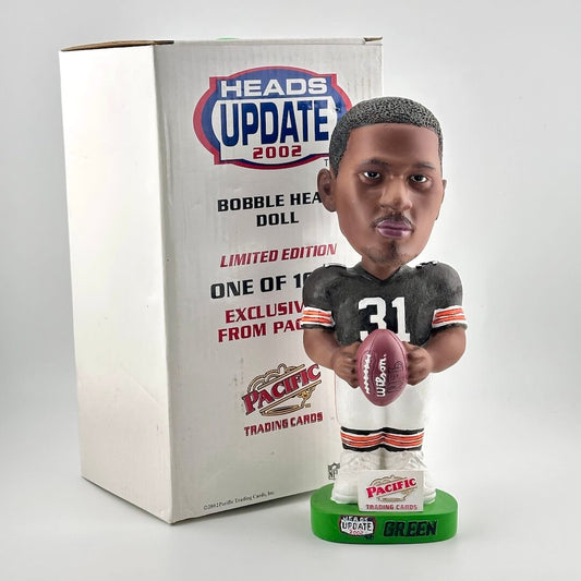 Bobblehead doll with a football and packaging labeled 'Heads Update 2002' on a white background