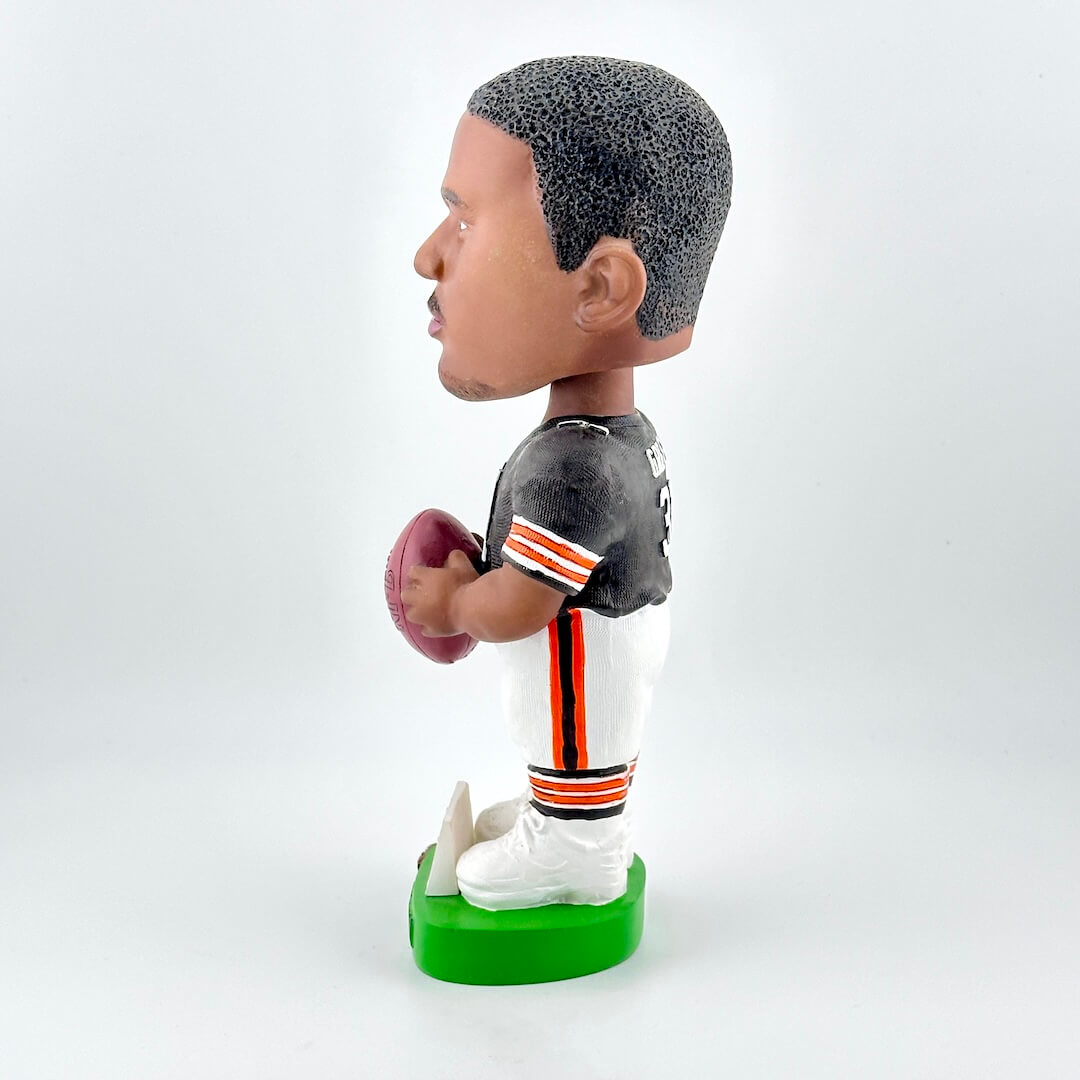 Bobblehead figure of a football player in a sports uniform on a white background