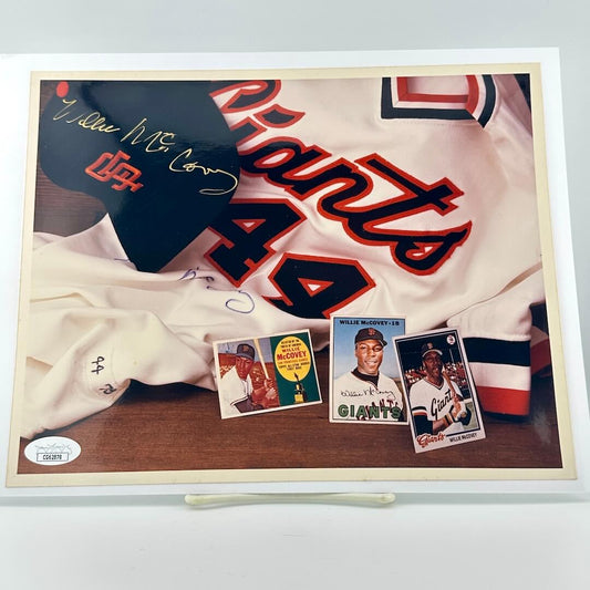Photograph of memorabilia collage featuring signature of player, JSA authentication sticker in corner. 