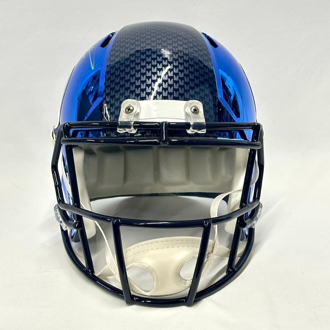 Blue chrome football helmet with Seattle branding against white background. 