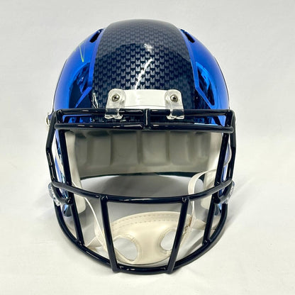 Blue chrome football helmet with Seattle branding against white background. 