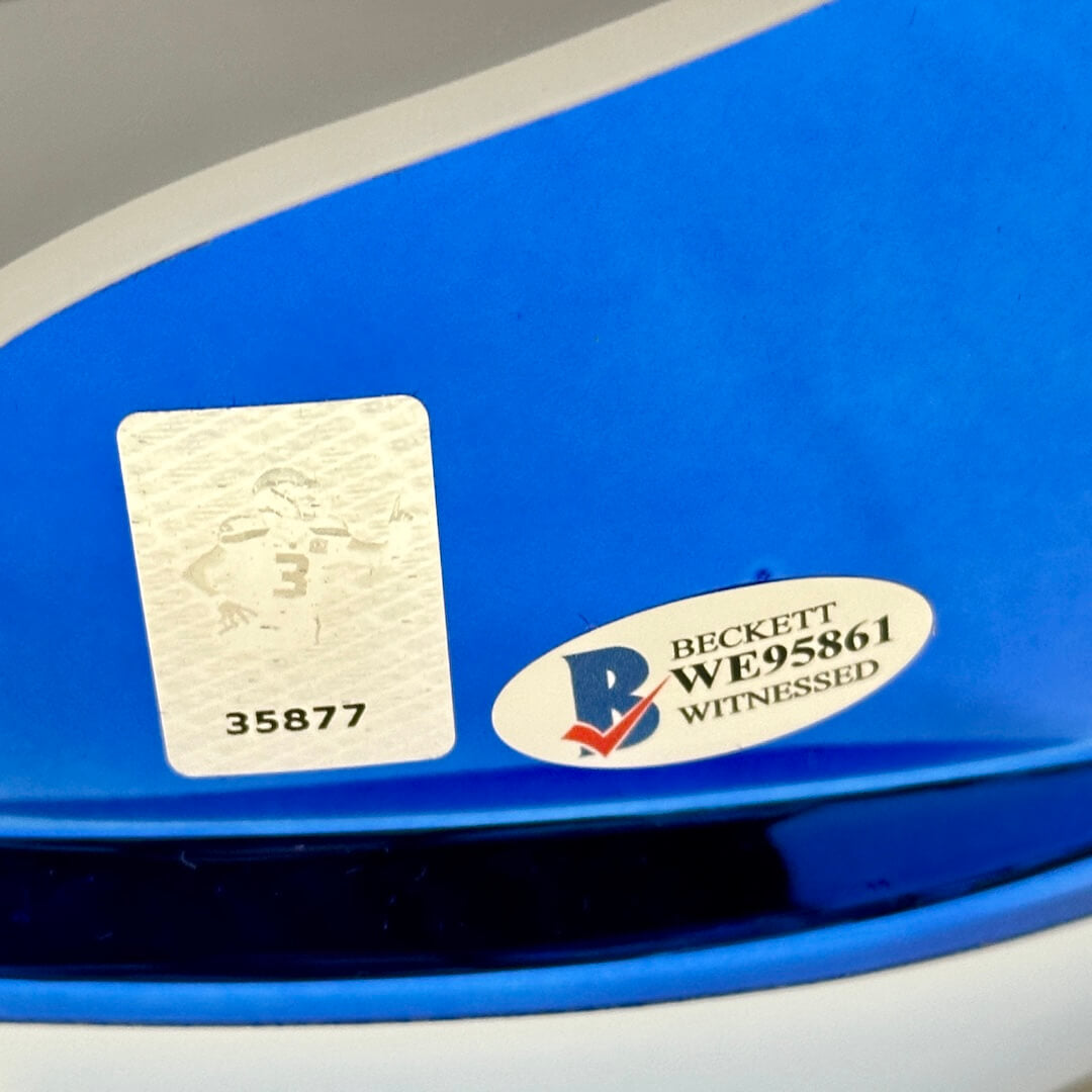 Close-up of a blue helmet with a Beckett authentication label. WE95861