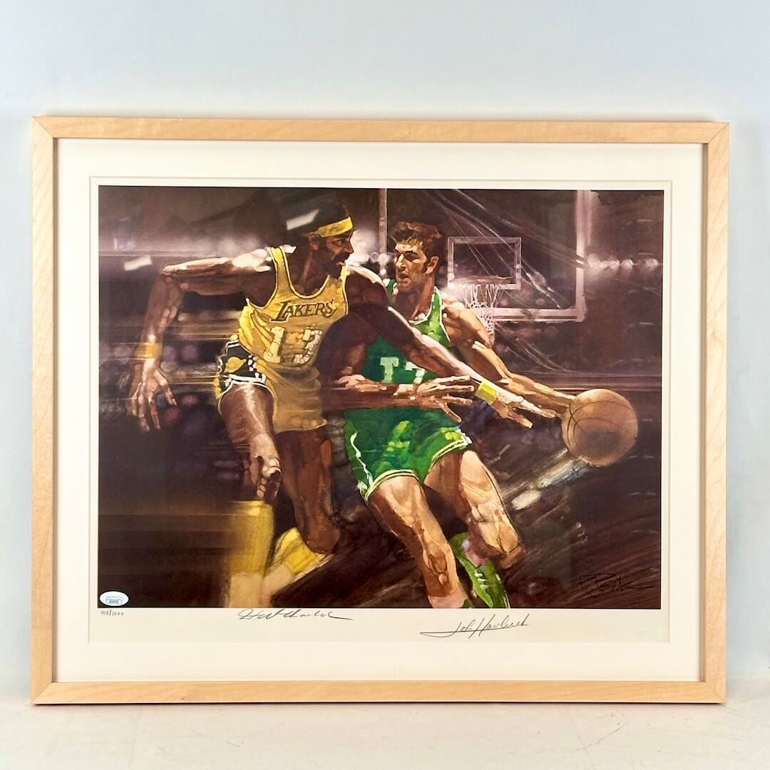 Framed artwork of two basketball players in action on a court.