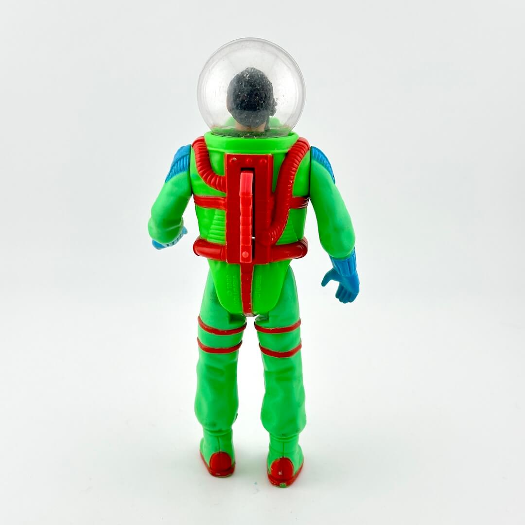 Action figure in green astronaut suit with helmet on white background. 