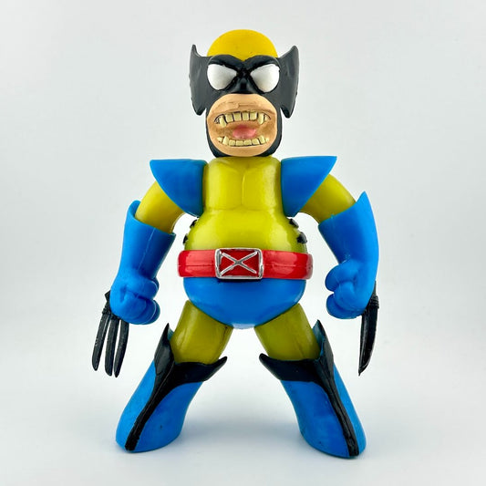 Toy figure resembling a superhero with blue and yellow costume on a white background