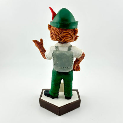 Bobblehead figure of a character with a green hat and brown outfit on a white background