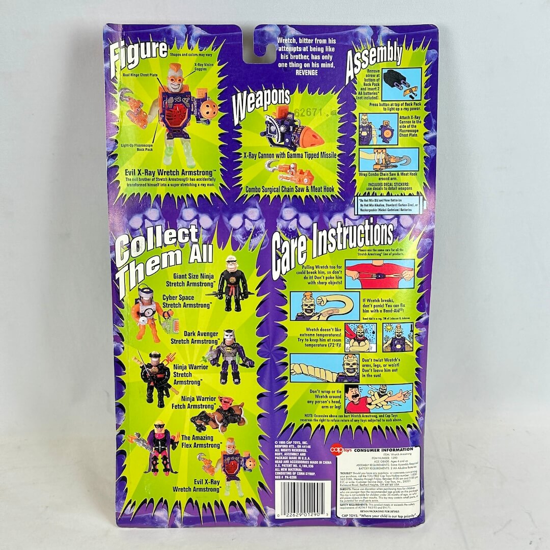 Vintage action figure packaging with character illustrations and text on a purple background