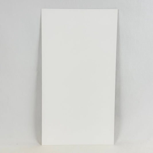 Backside of art print showing white rectangular paper photographed on white background. 