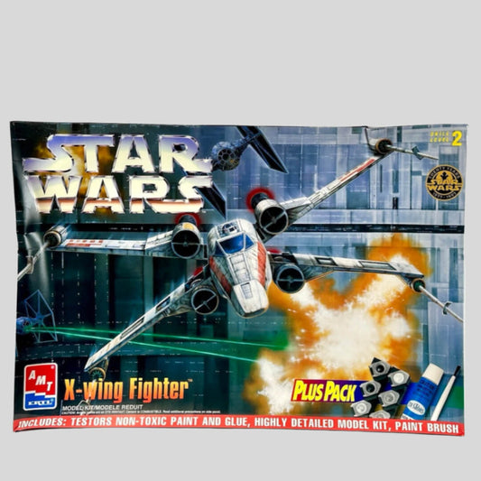 Box with image of Star Wars' ship, x-wing fighter, in battle scene with TIE fighters & Death Star in background.