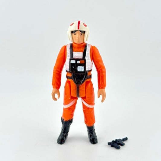 Action figure in orange flight suit with white helmet and vest with weapon on white background. 