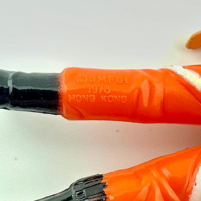 Close-up of COO and copyright information on the back of the leg of the figure. 