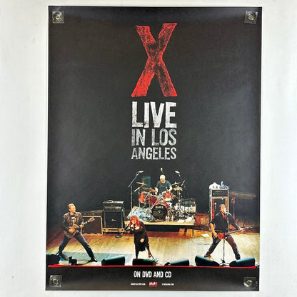 Poster of a band performing on stage with 'X Live in Los Angeles' text.