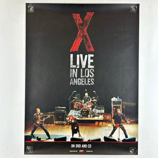 Poster of a band performing on stage with 'X Live in Los Angeles' text.