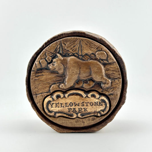 Ceramic coin bank with wood-like appearance with bear above text, "Yellowstone Park"