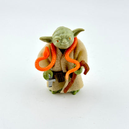Yoda action figure with accessories on white background.