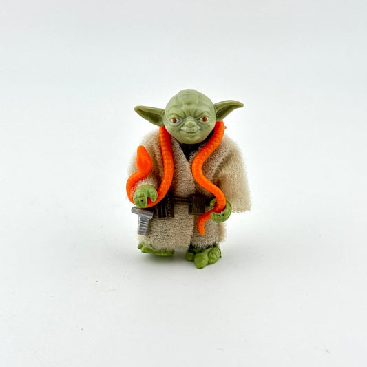 Toy figure of Yoda from Star Wars on a white background