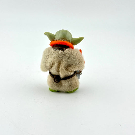 Small action figure resembling a character from a popular franchise on a white background