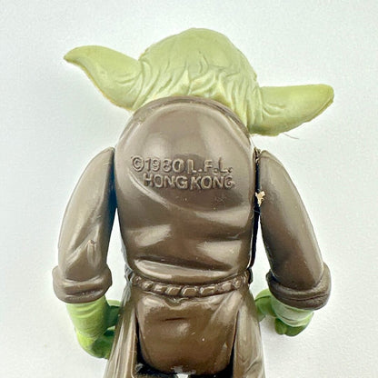 Back view of a Yoda figure with '1980 L.F.L. Hong Kong' text on the back.