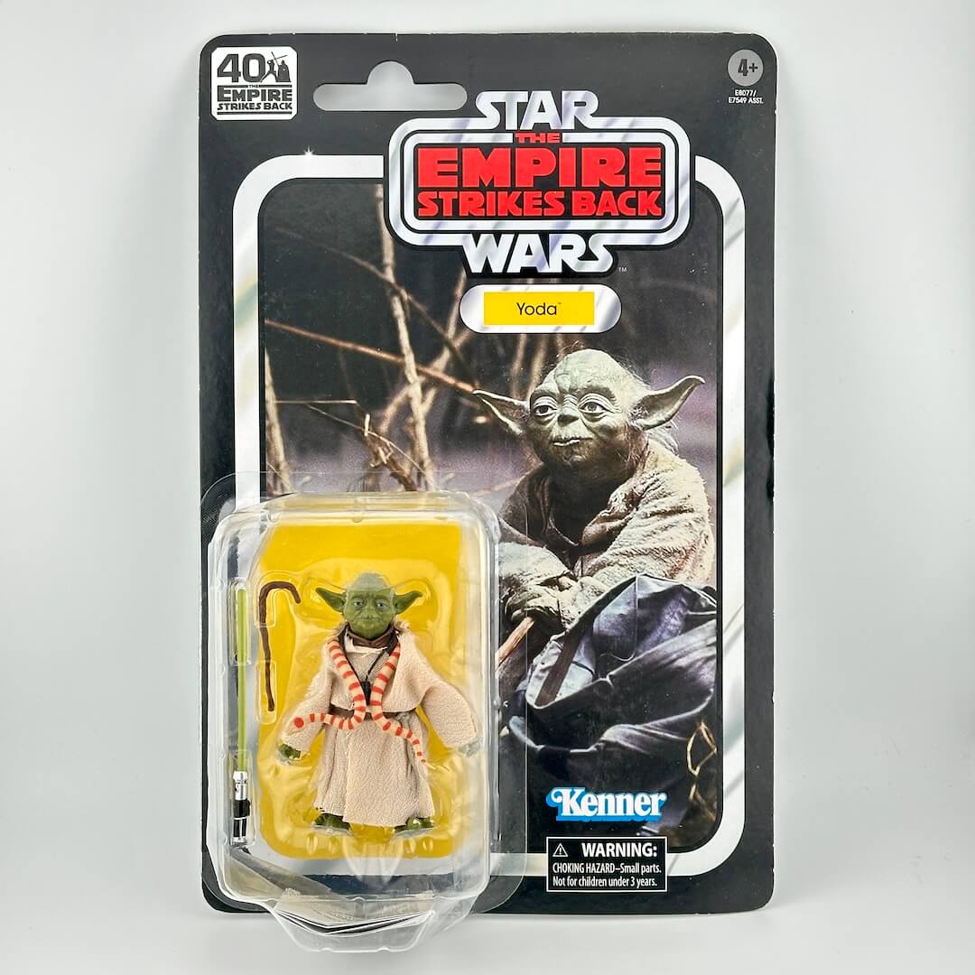 Star Wars action figure in its original blister packaging with retro-style card back; figure is small Yoda with snake.