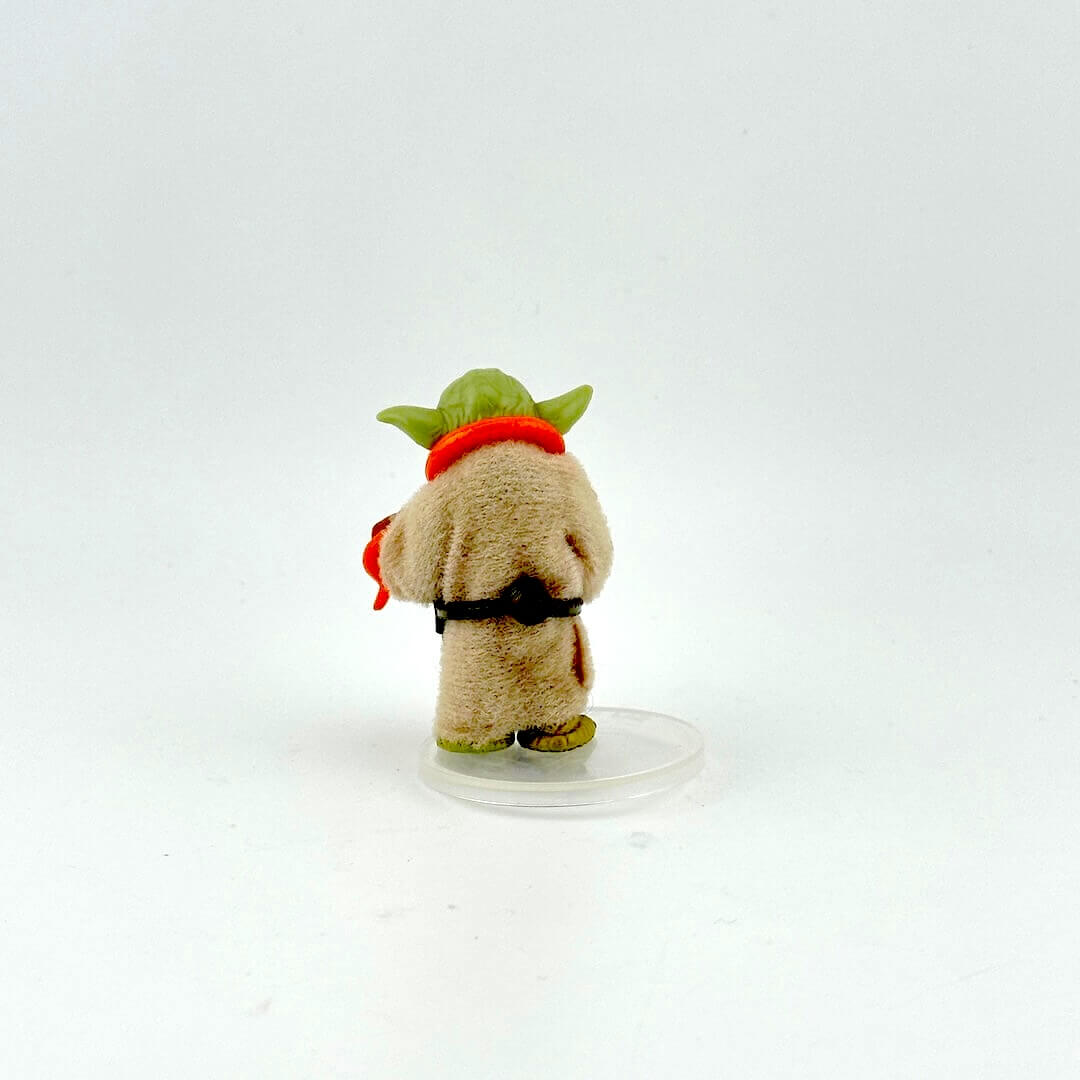 Yoda action figure with all accessories against white background.