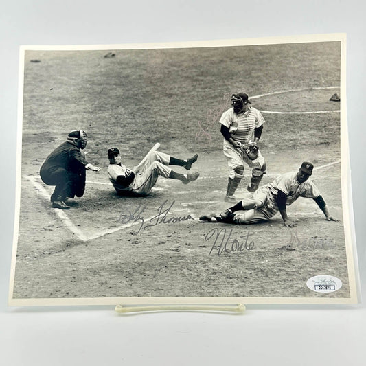 Vintage black and white photograph of a baseball game with players on the field, signed by a player.