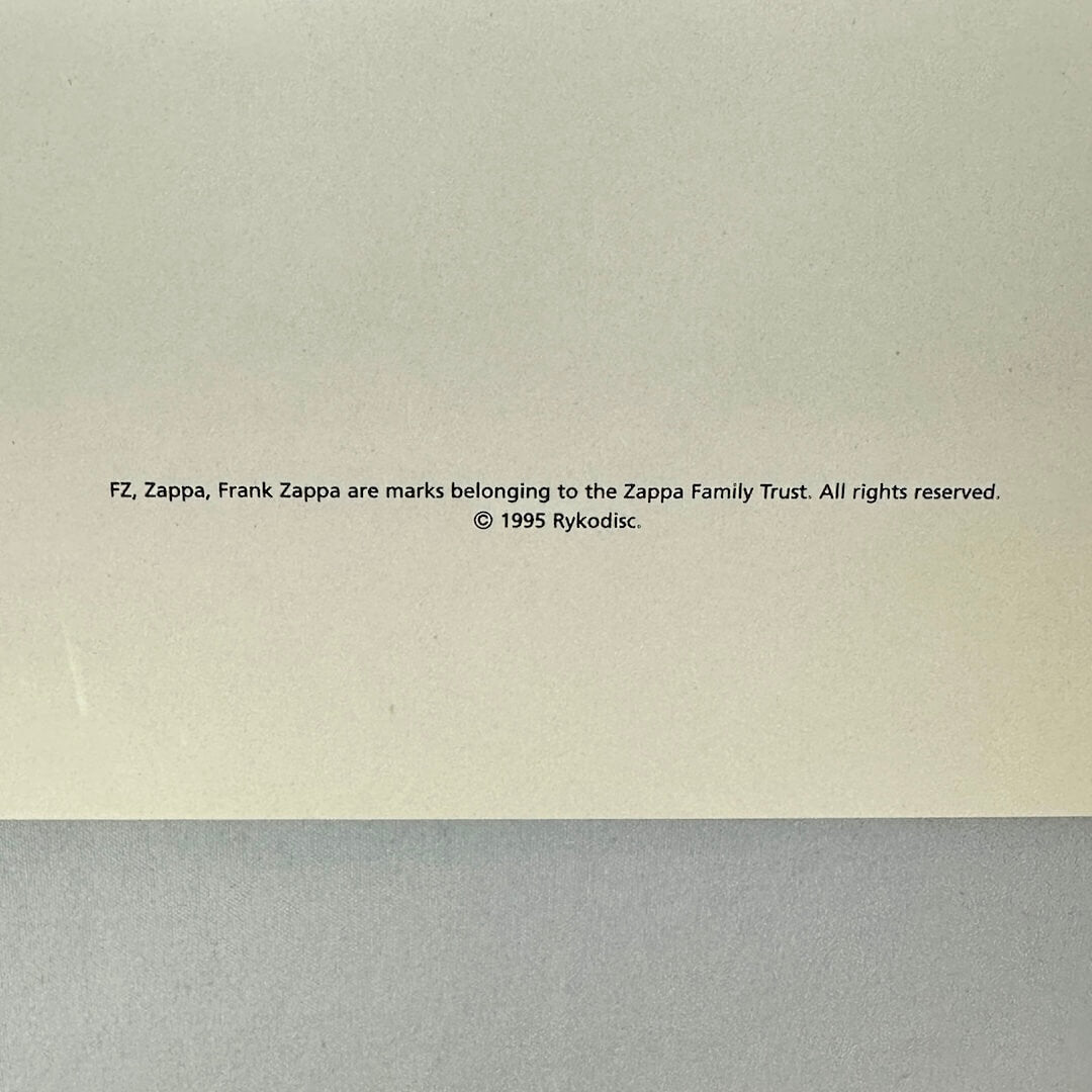 Copyright notice for Frank Zappa on a beige and gray background