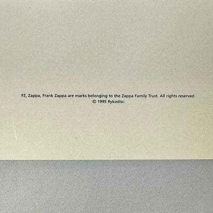 Copyright notice for Frank Zappa on a beige and gray background