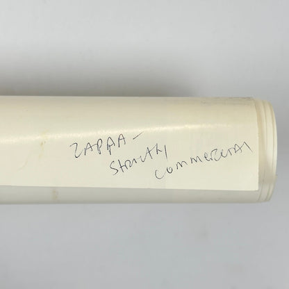 Rolled poster with artist name written in pen on backside. 