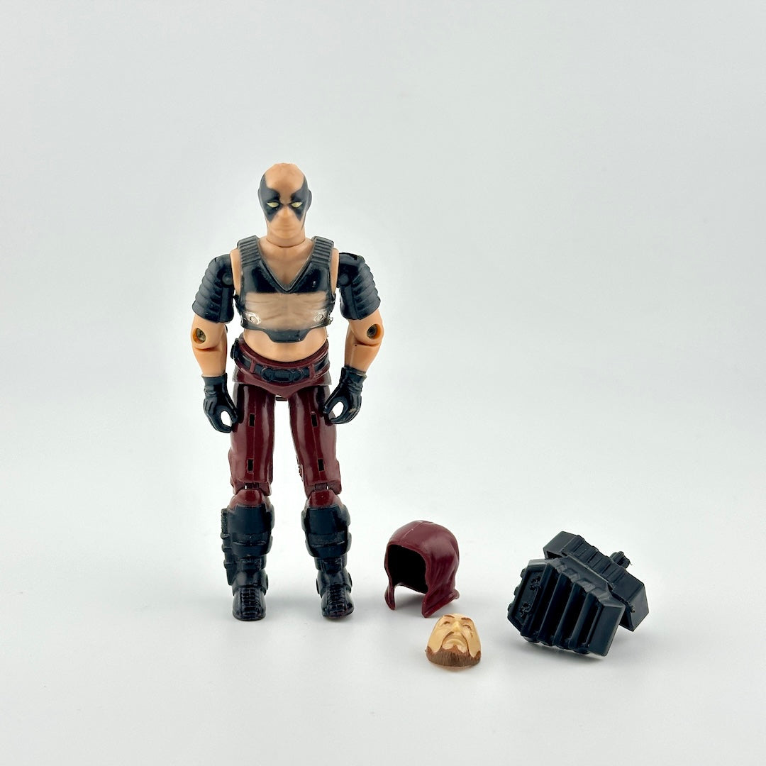 GI Joe action figure with accessories against white background. 