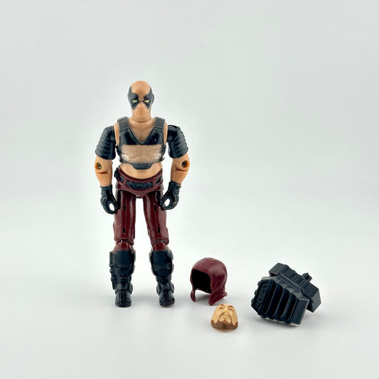 GI Joe action figure with accessories against white background. 