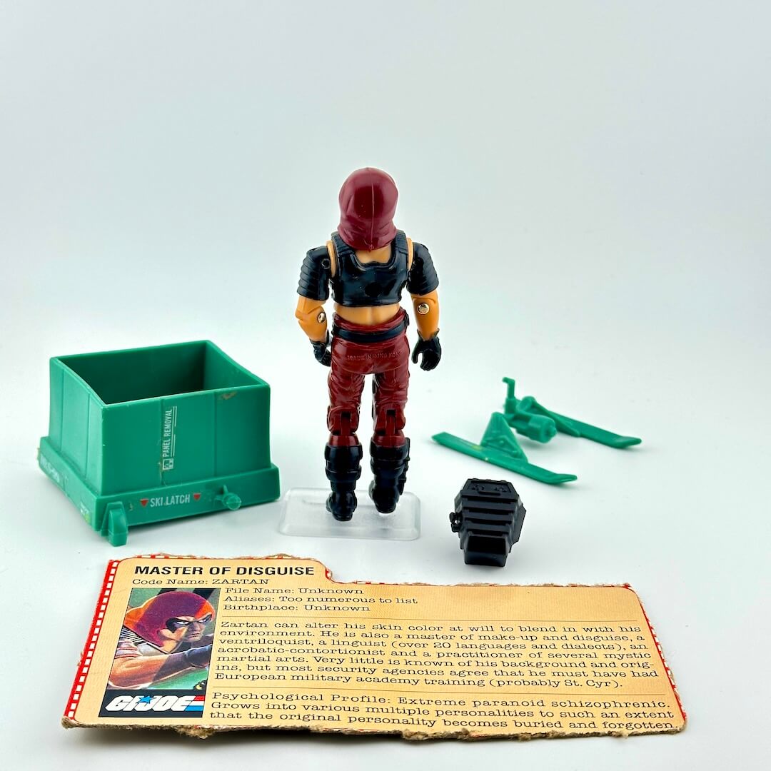 Toy figure with accessories and character card on a white background