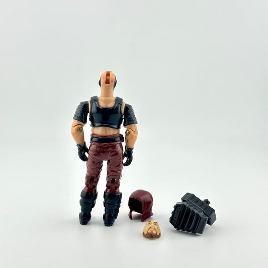 GI Joe action figure with accessories against white background. 