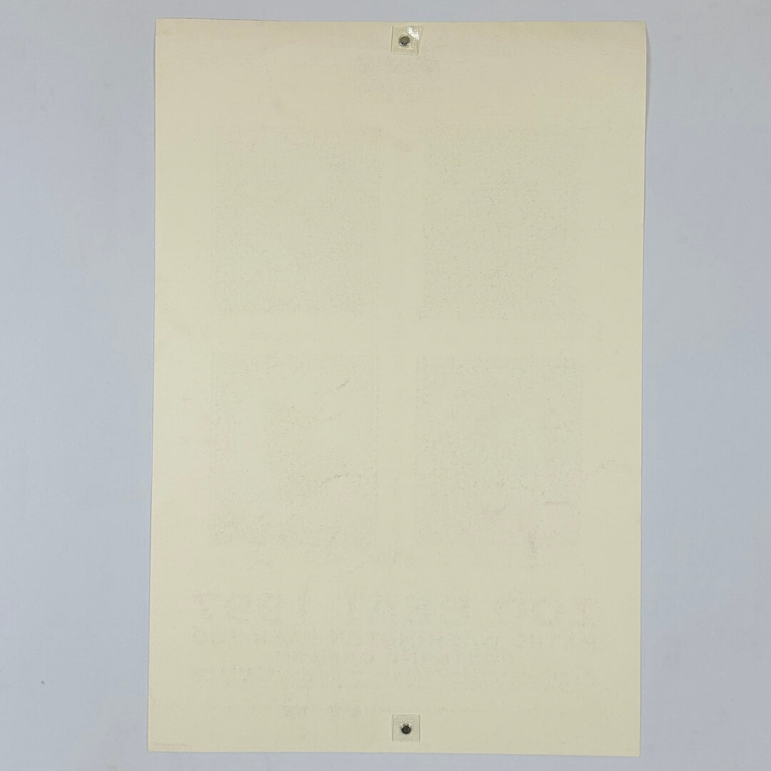 Backside of beige poster against white background. 