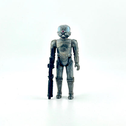 Action figure of gray cyborg holding big black gun against white background. 