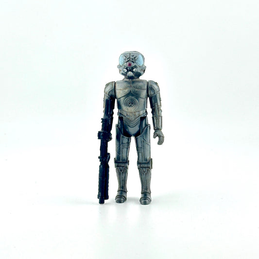 Action figure of gray cyborg holding big black gun against white background. 