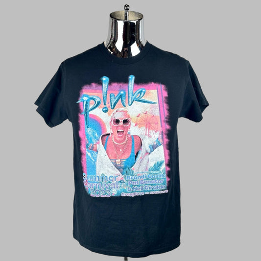 Bright colored picture of p!nk in carnival setting with event info along bottom in blue text, her name at the top.